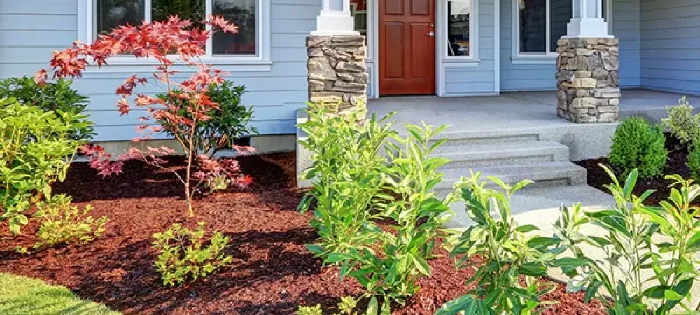 Residential landscaping - home with nice flower beds